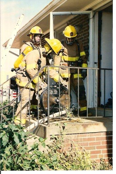 Picture of Amy Garrison, Kevin Garrison & Lee Battle at house fire in the 1990's. Photo by Paul Delgado